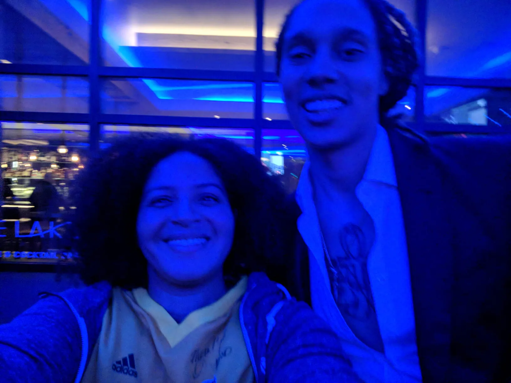 Me, with Brittney Griner, left under blue lights.